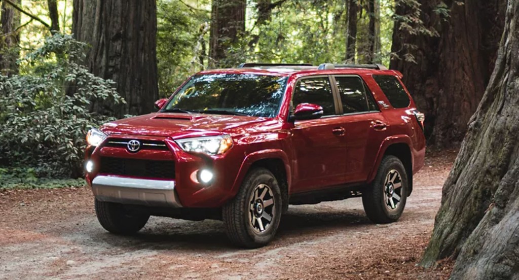 A red Toyota 4Runner SUV is parked. 
