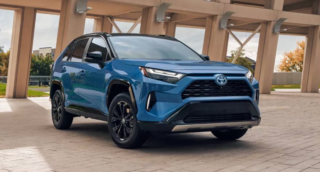 A blue 2022 Toyota RAV4 Hybrid SUV is parked. 