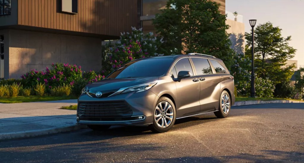 A gray 2022 Toyota SIenna is parked on the road. minivan