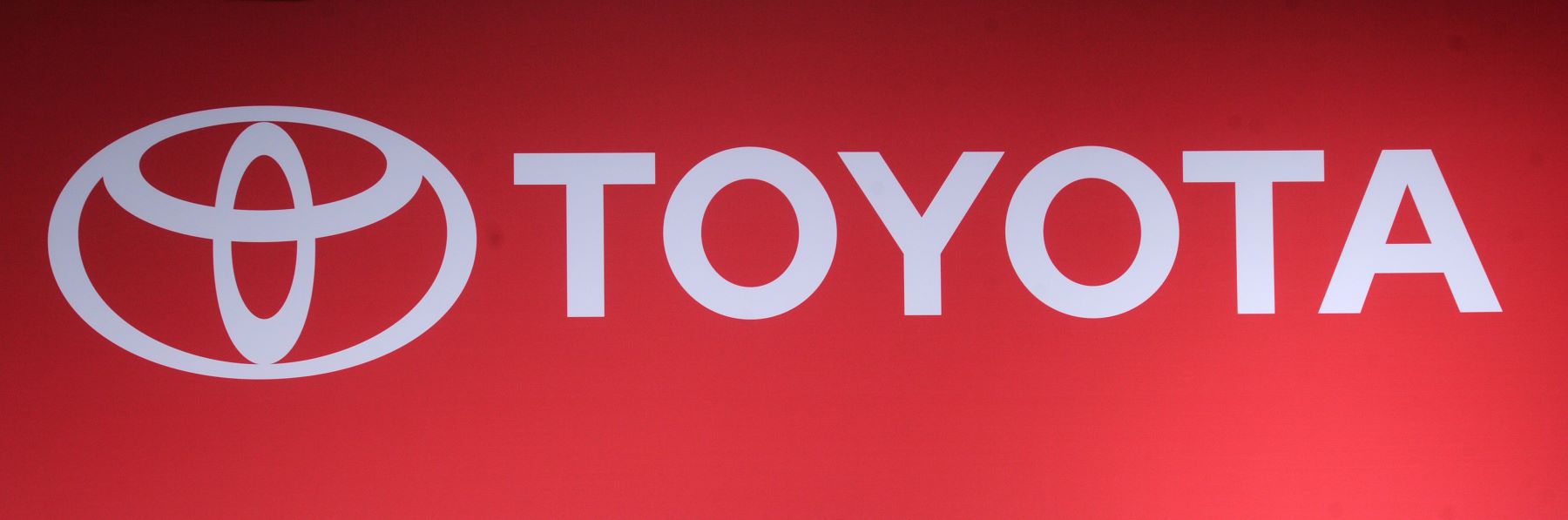 Toyota Japanese automaker logo with white text on a red background