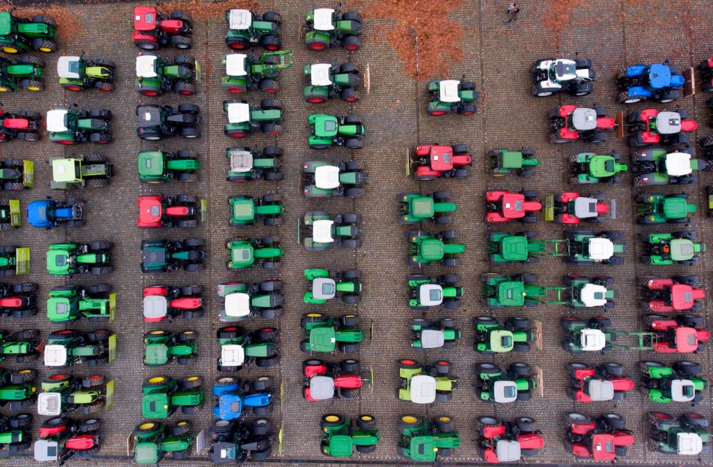 Rows of tractors parked together.