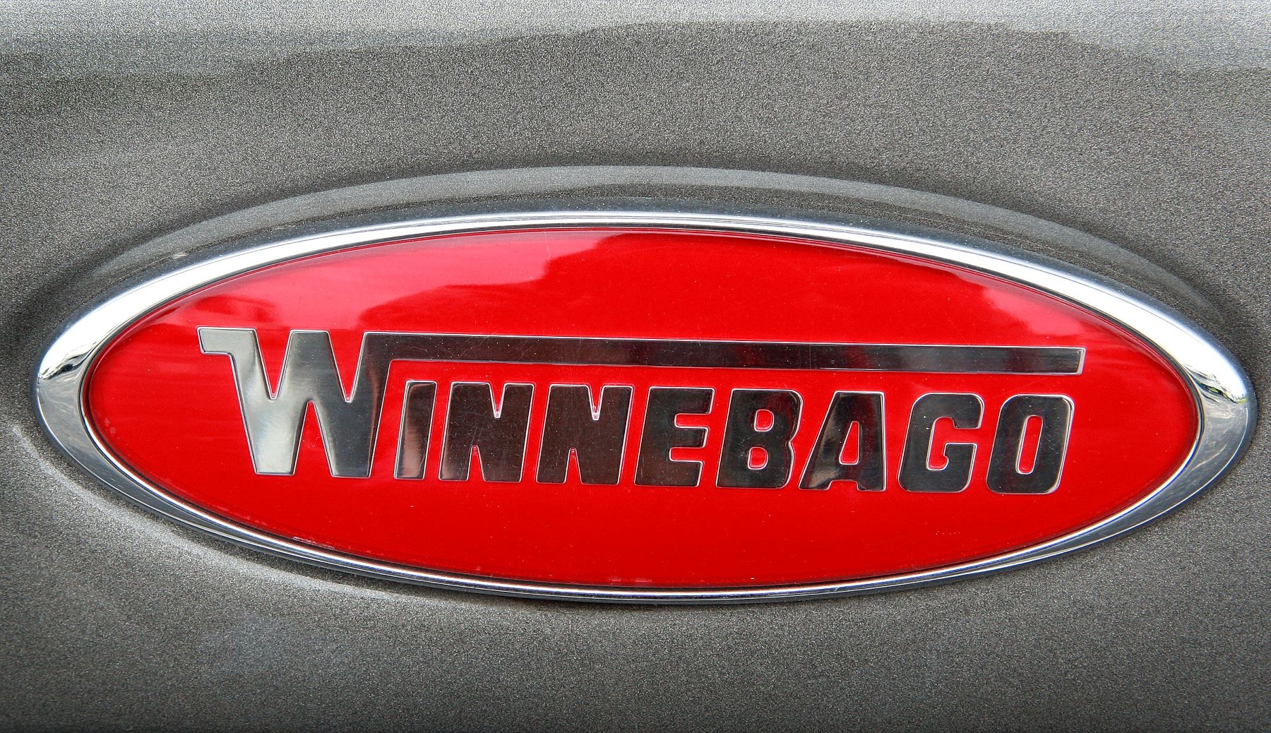 The Winnebago logo badging on a Sightseer motor home at the Camp-Land RV dealership in Burns Harbor, Indiana