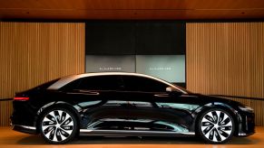 A black 2022 Lucid Air Grand Touring, the best luxury electric car, parked at the Lucid Motors Inc. studio in California