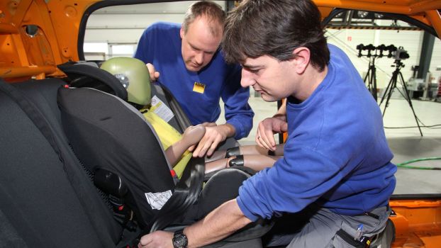 A crash test dummy child seat car safety test