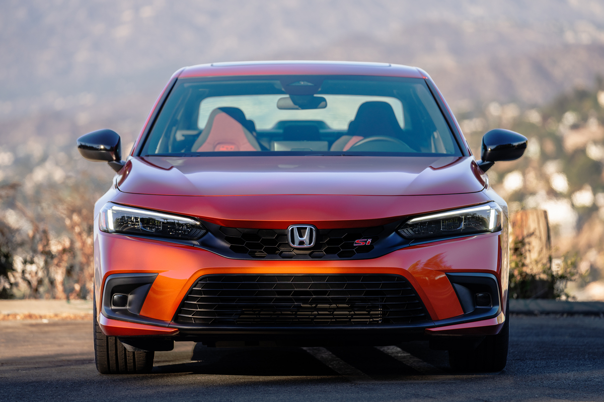 Close-up of the front of a 2022 Honda Civic Si sedan in orange