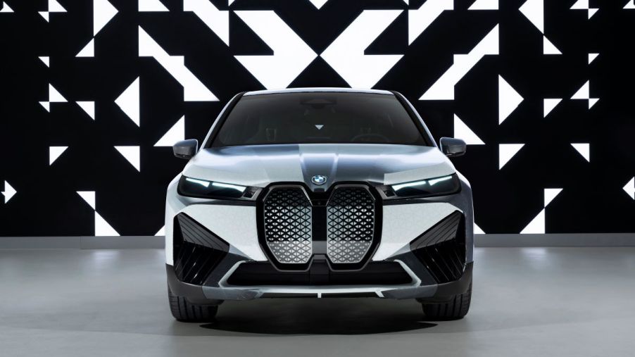 Front end of the color-changing paint on the BMW iX M60 SUV. Black and white body panels compliment the black-and-white abstract background