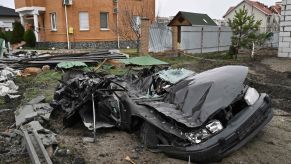 A car crushed by a Russian military tank in the Dmytrivka village of Kyiv, Ukraine