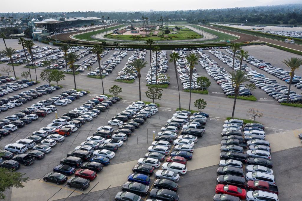 Aerial view of thousands of rental cars in the parking lot