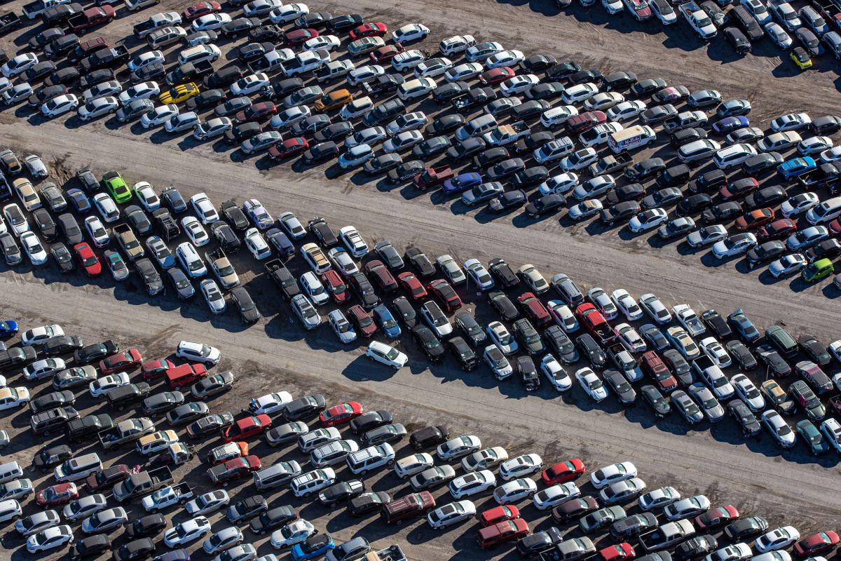 Thousands of cars in a Nevada junkyard;  junkyard parts are a good deal