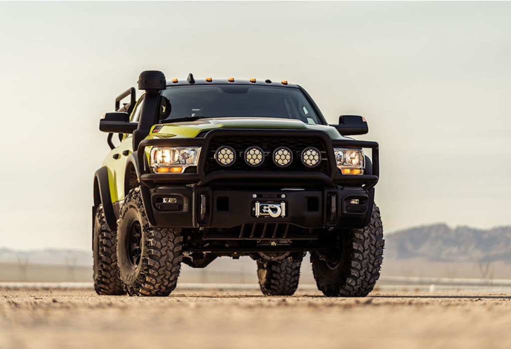 The AEV Prospector XL parked in the desert is a Ram Power Wagon with a Cummins Diesel