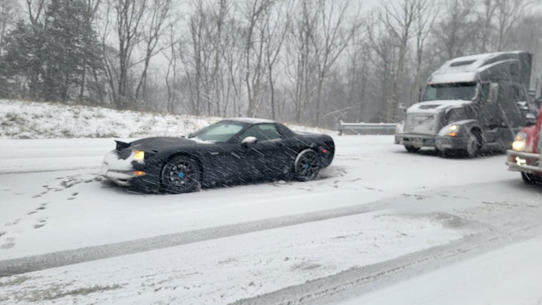 Jonathon Ramsey's Corvette stuck on the side of the snowy highway.