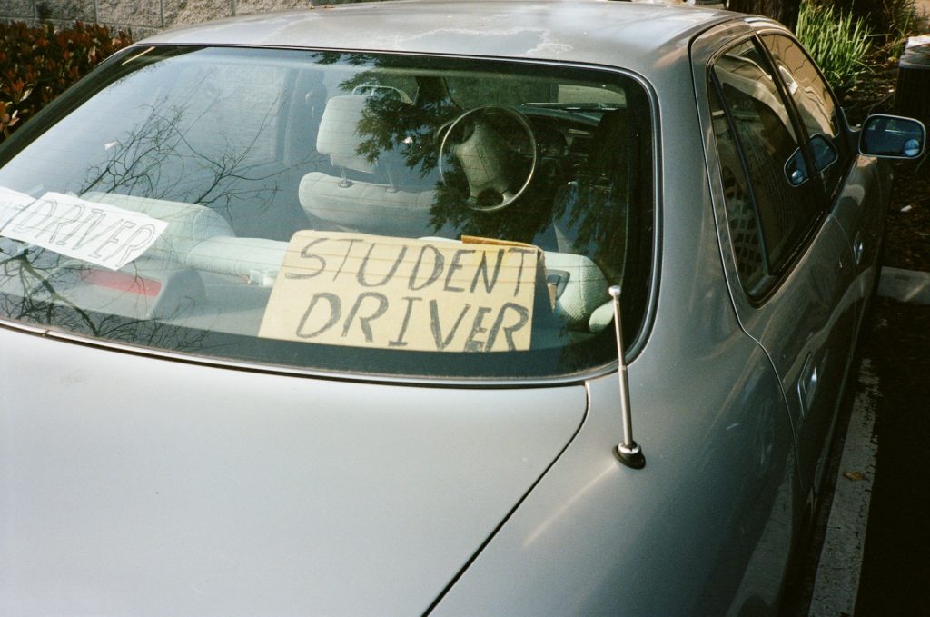 Rear view of car with student driver handwritten lettering