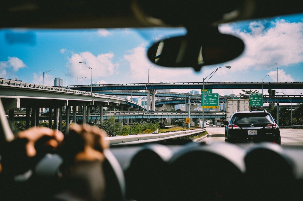 A car tailgating another car on the freeway