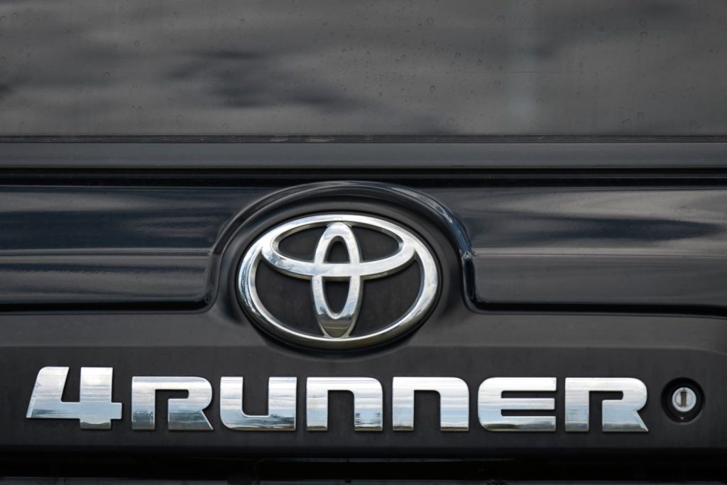 Close-up of a Toyota logo on the tailgate of a 4Runner model. The 4Runner is one of the most reliable used Toyotas