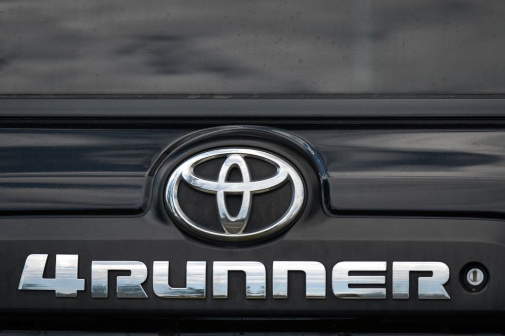 A close-up picture of the Toyota logo on the tailgate of the 4Runner model.  The 4Runner Is One of the Most Reliable Used Toyotas