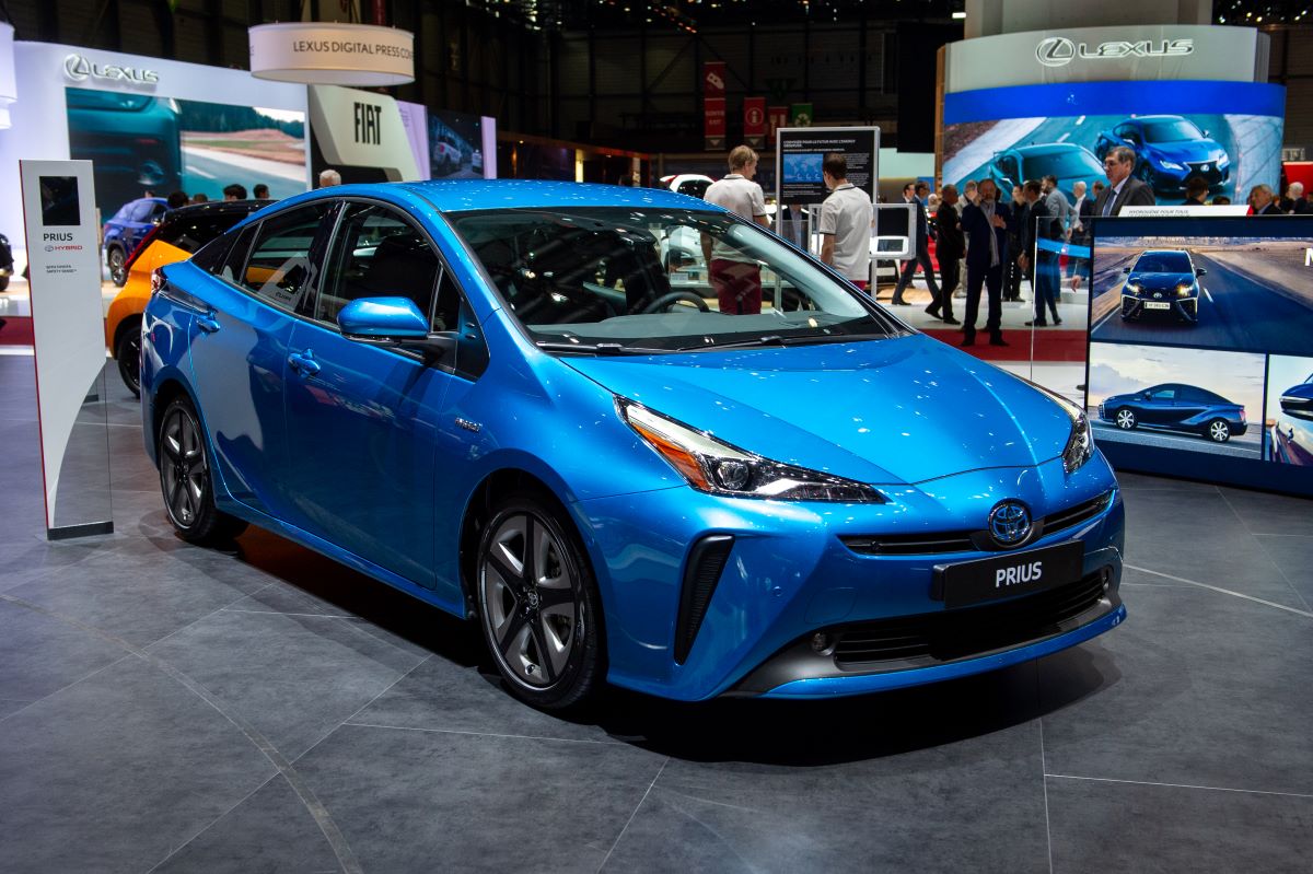 A blue Toyota Prius at the Geneva Auto Show; the Prius is the best hybrid car for 2022