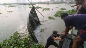 A capsized trawler boat being retrieved from the Turag river of Dhaka, Bangladesh