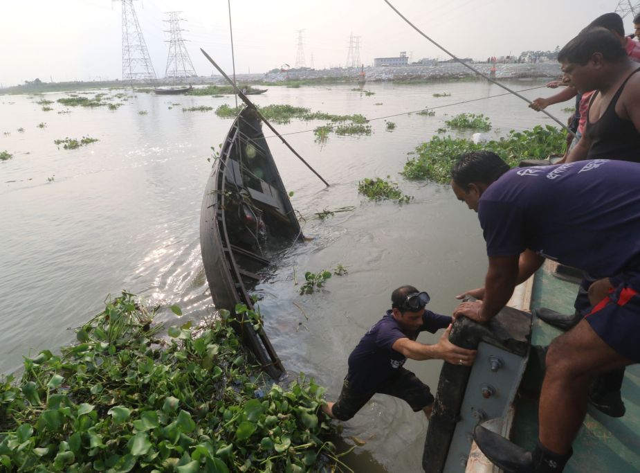 A capsized trawler boat being retrieved from the Turag river of Dhaka, Bangladesh