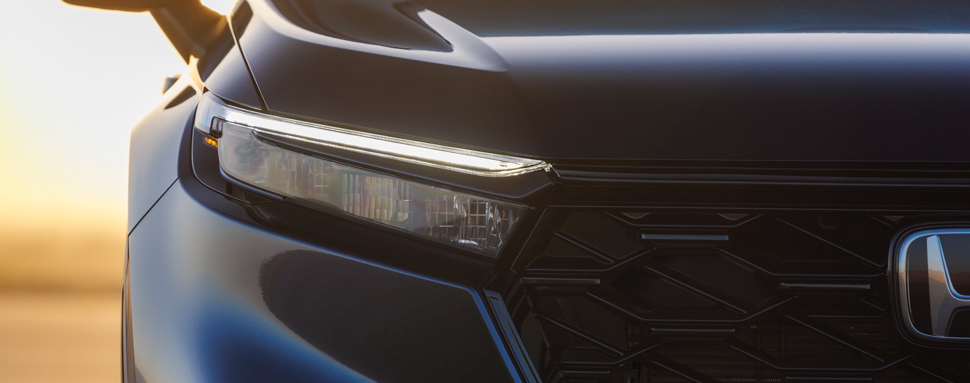 A teaser image of the front of a Honda CR-V