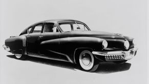 A black and white picture of a 1948 Tucker Torpedo.