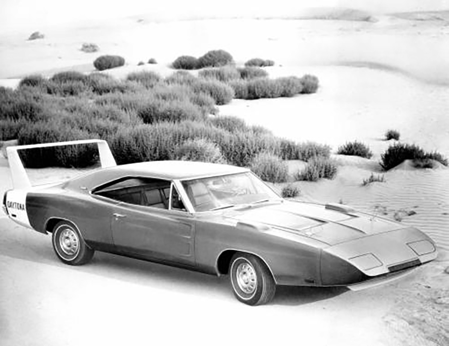 Front 3/4 of Dodge Charger Daytona parked in a desert in 1969