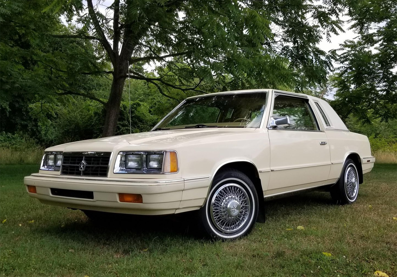 Front 3/4 of beige 1986 Dodge 600 Coupe , the Cheapest Cars and Bids Auction record holder