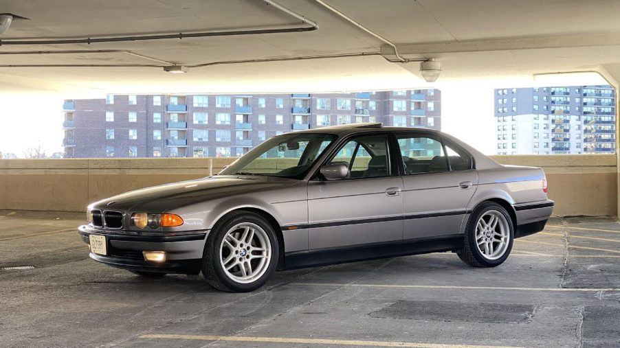 A gray 2000 E38 BMW 740i M Sport in a city parking garage