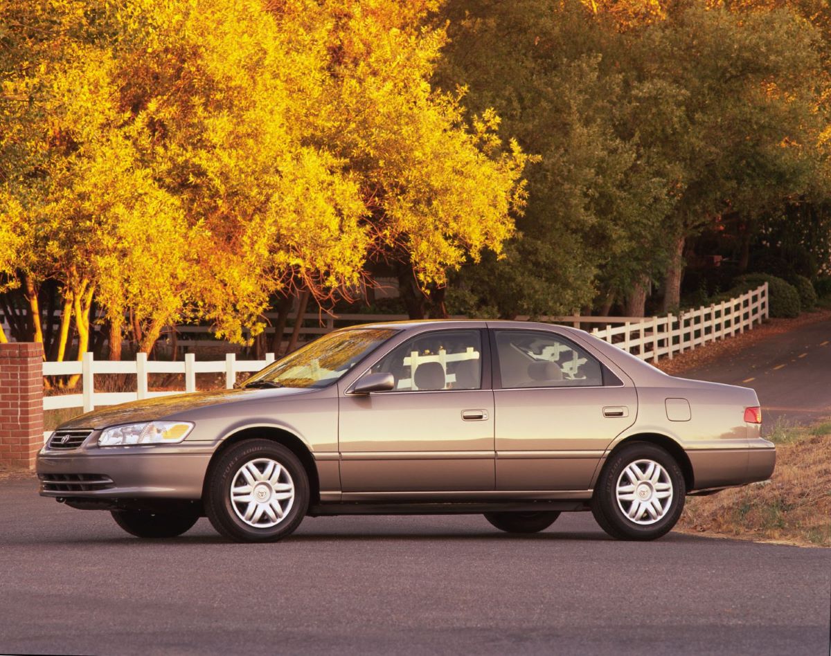 An old-school taupe 2001 Toyota Camry, one of the most unreliable Camrys you could find