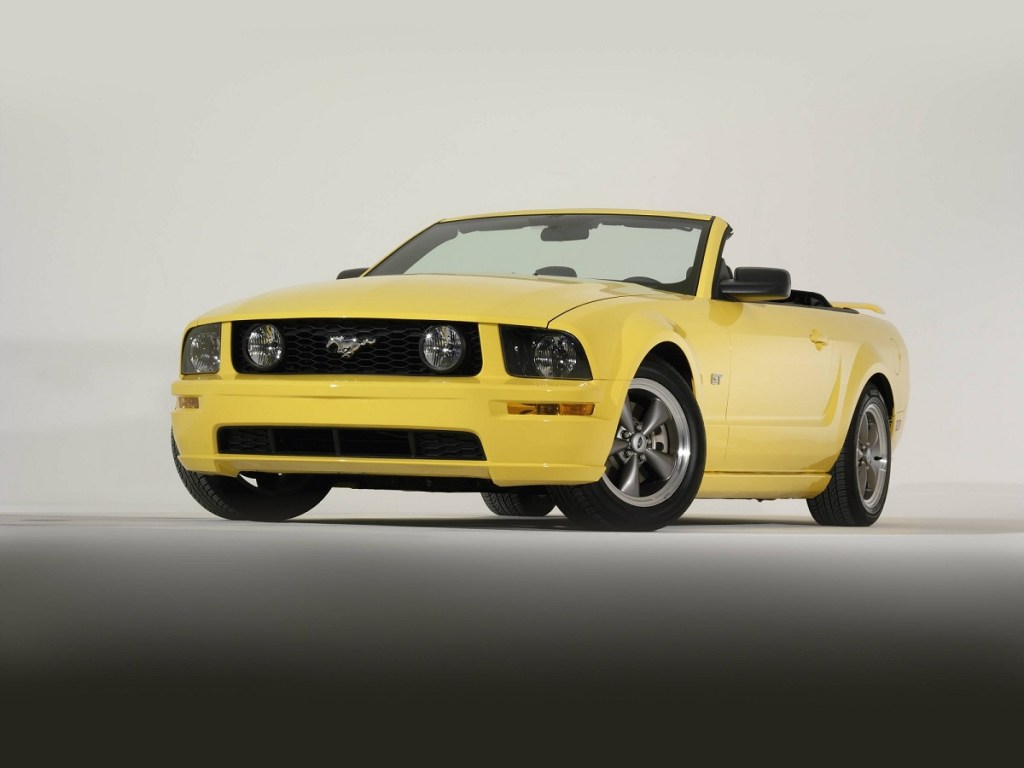 A 2005 Ford Mustang GT Convertible from the S197 generation shows off its yellow paintwork.