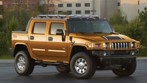 A yellow Hummer H2T truck
