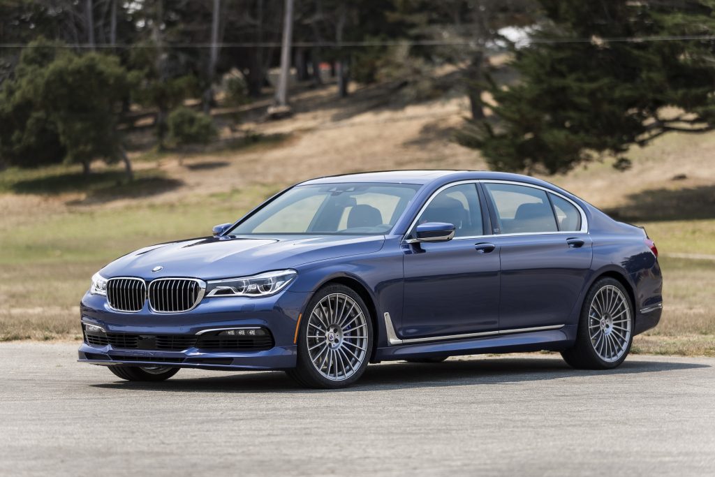 A blue 2013 BMW Alpina B7 in a parking lot