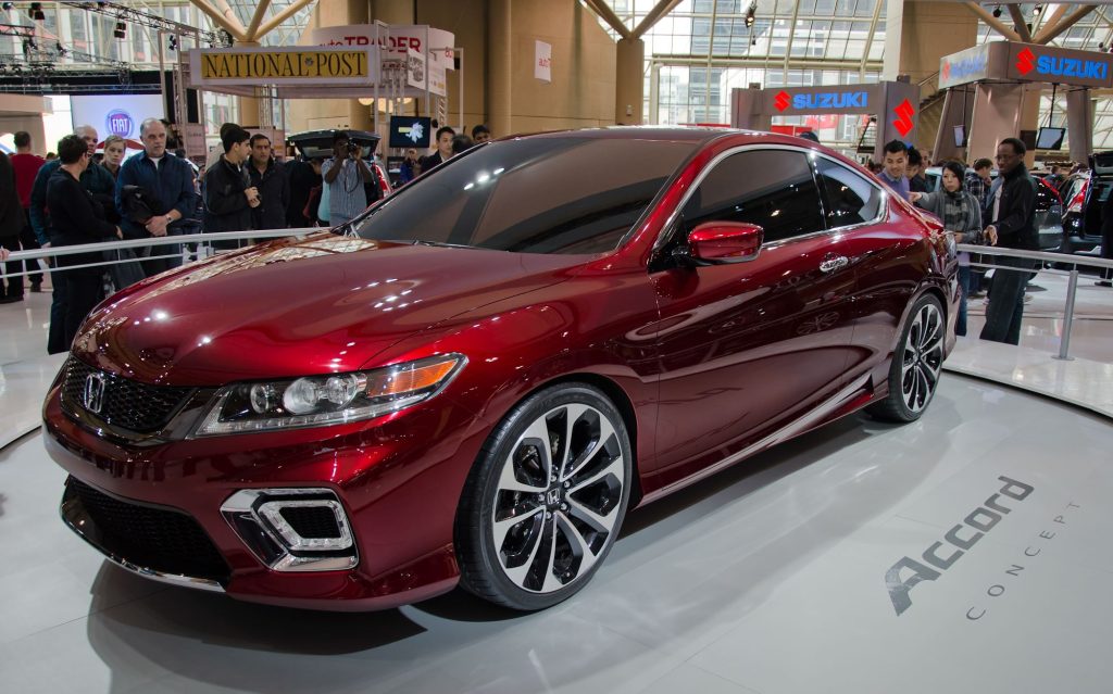 A red 2013 Honda Accord, among the best used cars, sitting indoors. 