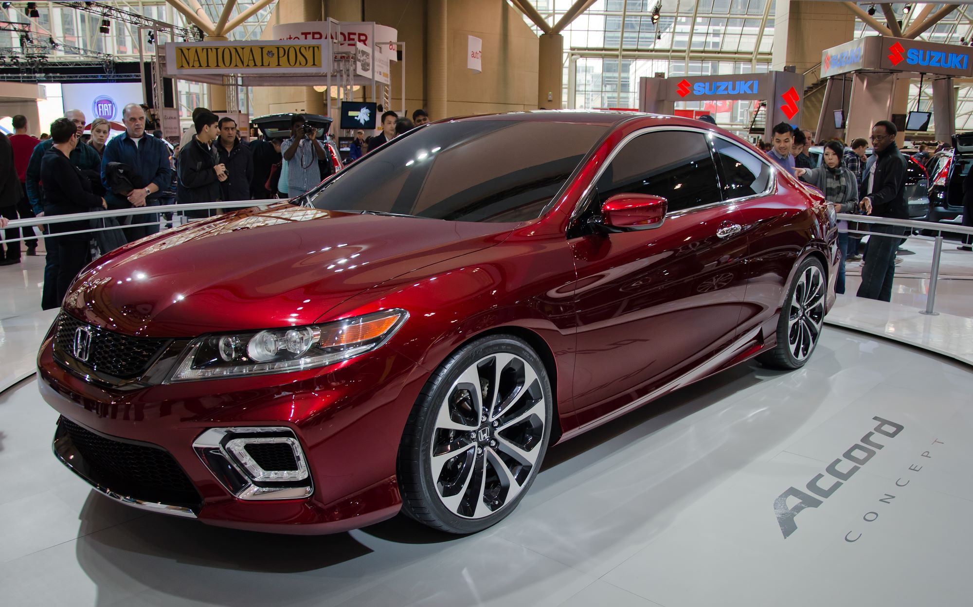 A red 2013 Honda Accord sitting indoors.