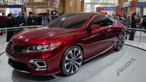A red 2013 Honda Accord sitting indoors.