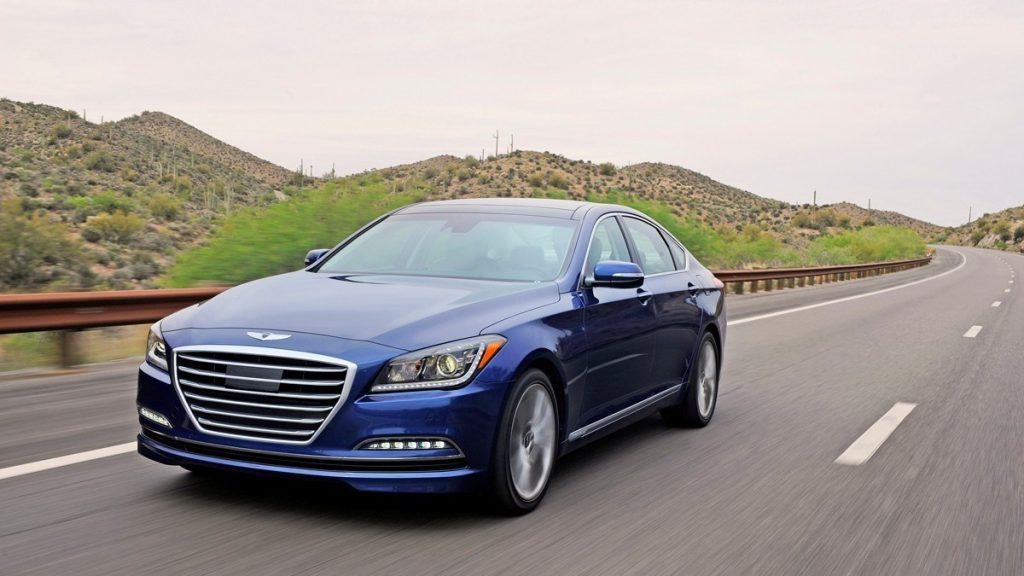 a 2016 hyundai genesis, your next used luxury sedan, drives along the road showing off its luxurious and refined styling