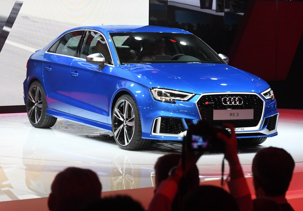 A blue 2017 Audi RS3 on stage at the 2016 Paris Motor Show
