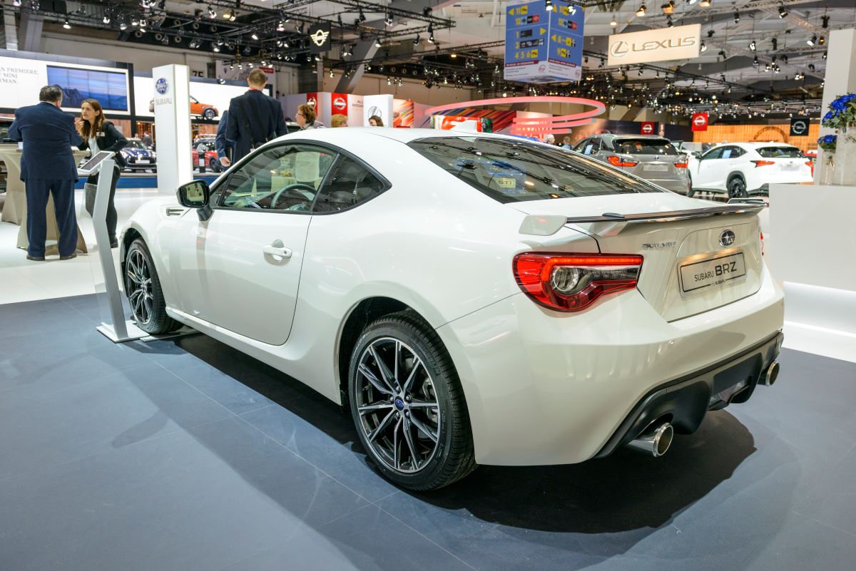 White 2017 Subaru BRZ sports car at an auto show; the Subaru BRZ's history is full of cool features