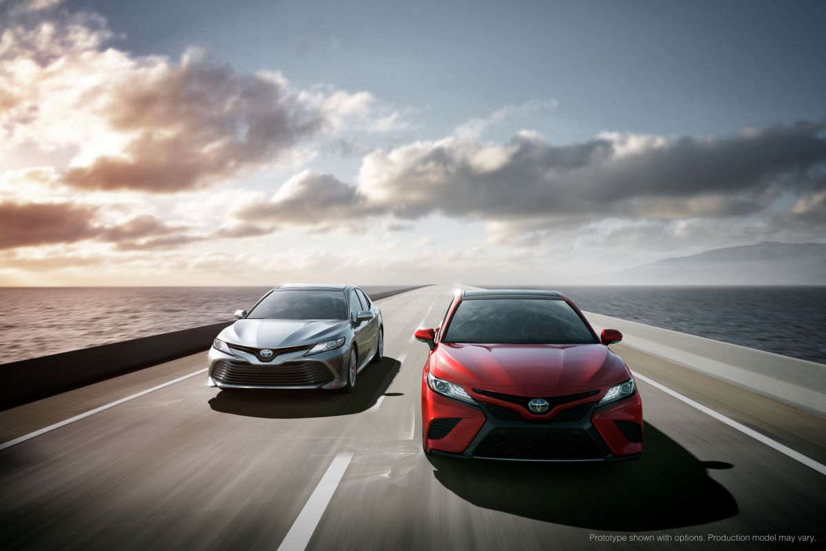 Two 2017 Toyota Camry sedans, the most reliable cars, race along an open highway