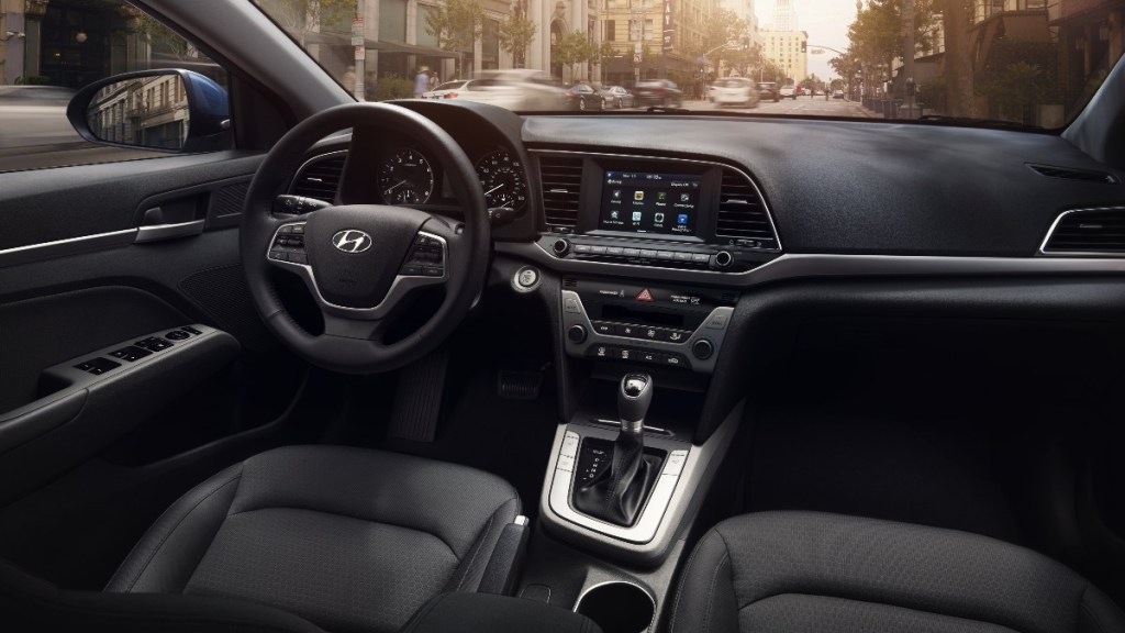 the comfortable, stylish and spacious interior of a used 2018 hyundai elantra sedan