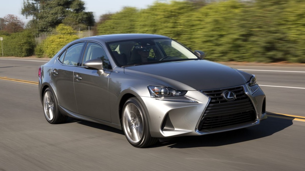 a modern and luxurious 2018 lexus is driving on a sunny road