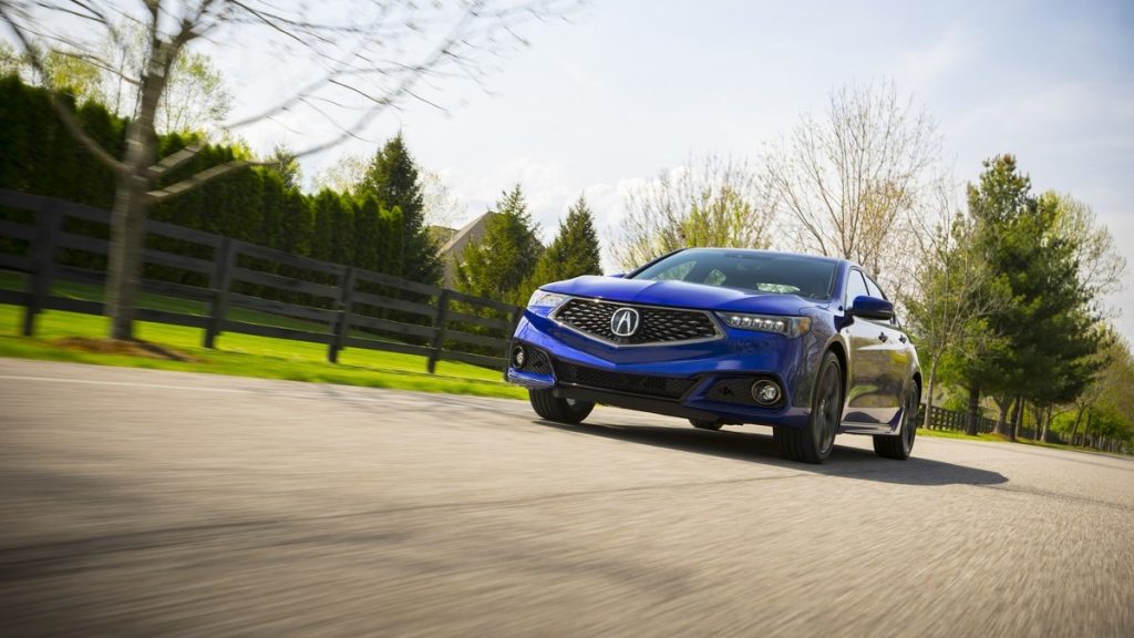 a blue 2019 acura tlx drives along the road showing off why its a great used acura