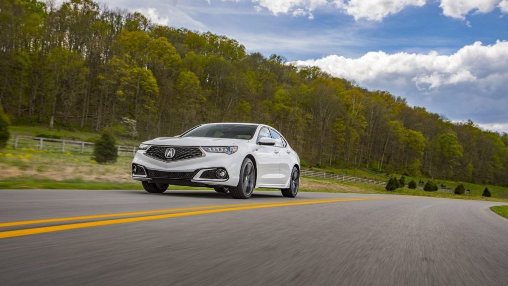 a white 2019 acura tlx, a great used luxury car, drives along the road and shows plenty of performance