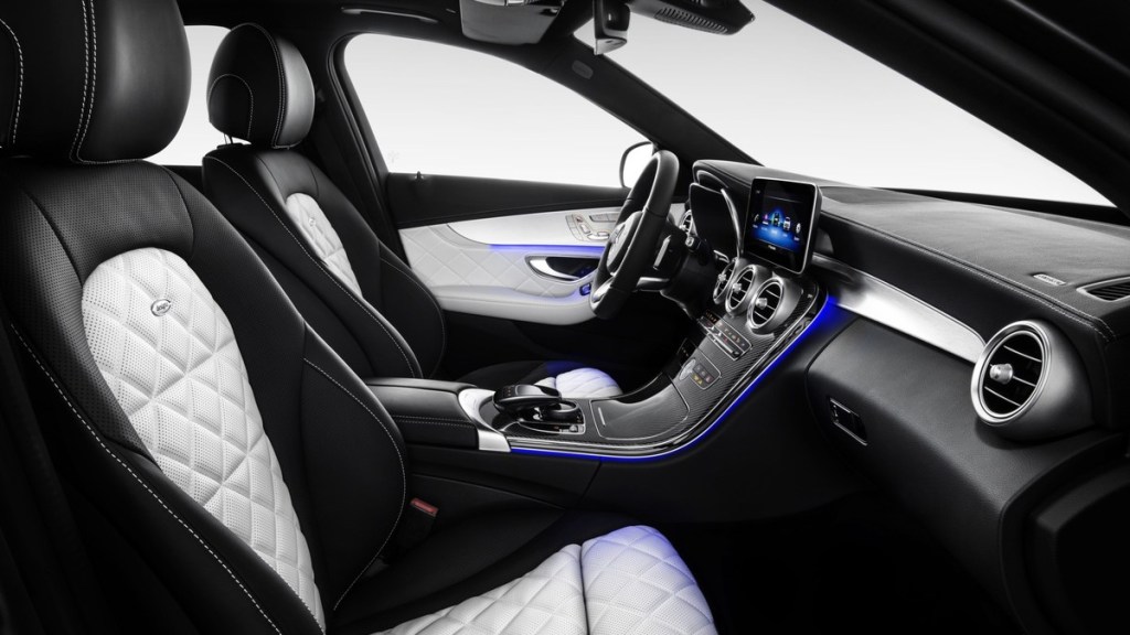 the luxurious interior of a 2019 mercedes-benz c-class sedan showing its supple leather seating and unique ambient lighting