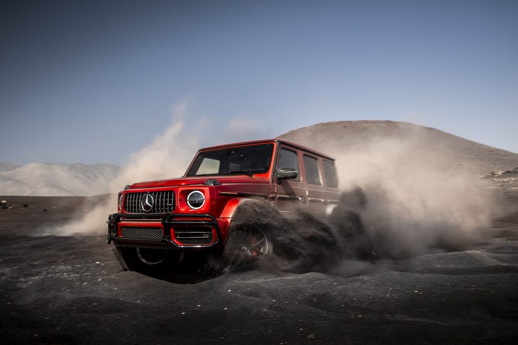 a red g-wagon in the dirt