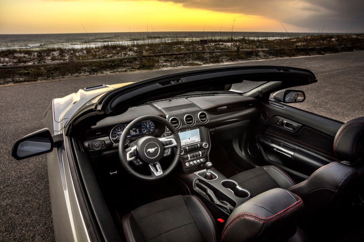 Interior of a Ford Mustang GT convertible with its top down, which is much more luxurious and comfortable than that of a Ford GT supercar