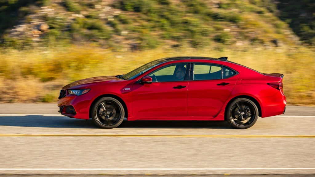 a unique 2020 acura tlx pmc edition zooms along the road
