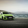 A bright-green 2022 Audi RS3 by the ocean