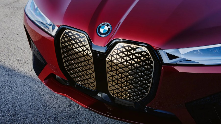 The front of a red 2022 BMW iX electric SUV.