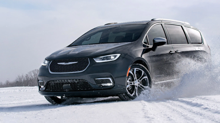2022 Chrysler Pacifica Pinnacle minivan with all-wheel drive (AWD) driving through off-road snow