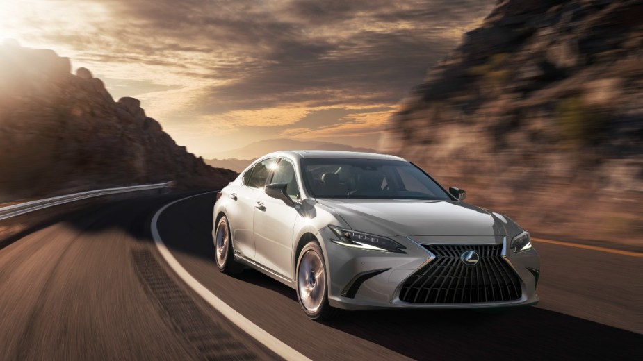 a silver lexus es drives along a canyon road showing off its comfortable suspension